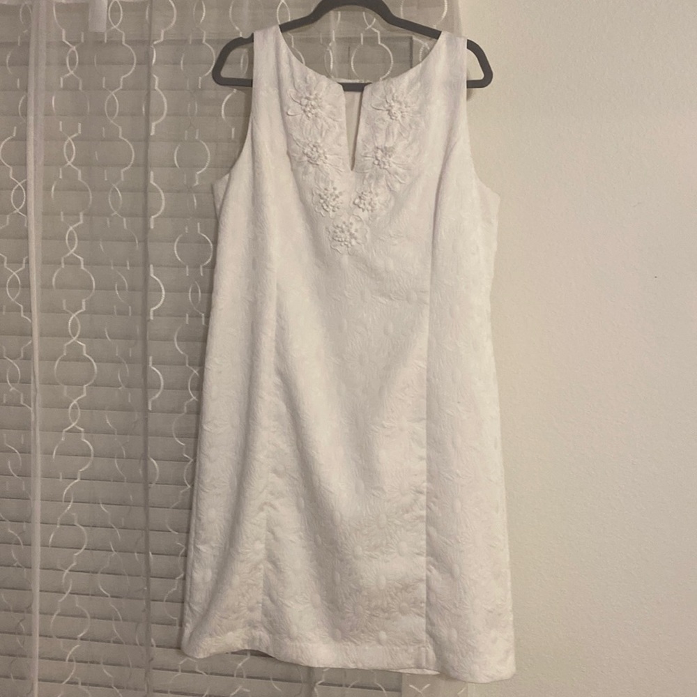 Dress in White, worn once, sits at the knee or little below